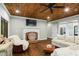Spacious living room with a brick fireplace, hardwood floors, and a ceiling fan at 915 Rocky Creek Rd, Hampton, GA 30228