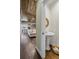 Small powder room with pedestal sink and ornate mirror at 915 Rocky Creek Rd, Hampton, GA 30228