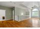 Upstairs hall with hardwood floors, access to bedrooms, and a view to below at 915 Rocky Creek Rd, Hampton, GA 30228