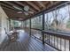 Inviting covered deck with ceiling fan and outdoor seating, ideal for relaxing and entertaining at 301 Jeanette St, Canton, GA 30114