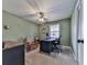 Home office with a ceiling fan, neutral walls, and carpeted floors at 301 Jeanette St, Canton, GA 30114