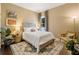 Comfortable bedroom with a bright bed, patterned rug, and natural light from the window at 1470 S Gordon Sw St, Atlanta, GA 30310