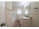 Bathroom with granite countertop, double vanity, and tile bath surround at 2104 Barbara Ln, Decatur, GA 30032