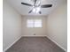 Bedroom with neutral carpet, ceiling fan, and window at 2104 Barbara Ln, Decatur, GA 30032