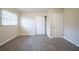 Bedroom with neutral walls, carpet flooring, window providing natural light, and closet at 2104 Barbara Ln, Decatur, GA 30032