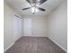 Bedroom features carpeted floor, ceiling fan, and closet at 2104 Barbara Ln, Decatur, GA 30032