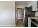 Kitchen with stainless steel refrigerator and granite counters at 2104 Barbara Ln, Decatur, GA 30032