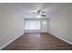 Spacious living room with wood flooring, ceiling fan, and natural light at 2104 Barbara Ln, Decatur, GA 30032