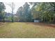 Spacious backyard with shed and mature trees at 1381 Flat Rock Rd, Stockbridge, GA 30281