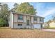 Lovely ranch home with updated siding, landscaping, and a green door at 1381 Flat Rock Rd, Stockbridge, GA 30281