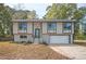 Charming ranch-style home with a two-car garage and updated exterior at 1381 Flat Rock Rd, Stockbridge, GA 30281