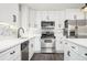 Bright kitchen with white cabinets, stainless steel appliances, and an island at 1381 Flat Rock Rd, Stockbridge, GA 30281