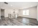 Spacious living room with hardwood floors and a modern light fixture at 1381 Flat Rock Rd, Stockbridge, GA 30281