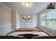 This bedroom features wood floors, neutral paint and is illuminated by two large windows at 270 Merrydale Dr, Fayetteville, GA 30215