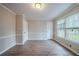 This bedroom features wood floors, neutral paint and is illuminated by two large windows at 270 Merrydale Dr, Fayetteville, GA 30215