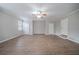 This bonus room features wood floors, neutral paint, a ceiling fan, and closet space at 270 Merrydale Dr, Fayetteville, GA 30215