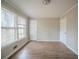 Living room featuring windows and neutral colored walls at 270 Merrydale Dr, Fayetteville, GA 30215