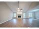 Spacious living room featuring vaulted ceilings, a brick fireplace, new flooring, and plenty of natural light at 270 Merrydale Dr, Fayetteville, GA 30215