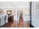 Welcoming foyer with hardwood floors, elegant wainscoting, and an open view to adjoining living spaces at 489 Spring View Dr, Woodstock, GA 30188