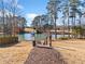 Picturesque community lake access for residents, with a sign posted with rules at 489 Spring View Dr, Woodstock, GA 30188