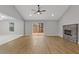 Bright living room with vaulted ceiling, modern fireplace, and access to a rear deck at 1271 Marcelle Heights Pl, Norcross, GA 30093