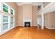 Spacious living room with hardwood floors, fireplace and high ceilings at 1456 Reagan Nw Cir, Conyers, GA 30012