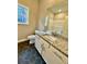 Bathroom featuring tub, granite countertop vanity, and hexagon tile flooring at 3740 Cobblestone Dr, Loganville, GA 30052