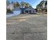 Charming single-story home with a manicured lawn and attached two-car garage at 3740 Cobblestone Dr, Loganville, GA 30052