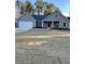 Charming single-story home with a manicured lawn and attached two-car garage at 3740 Cobblestone Dr, Loganville, GA 30052