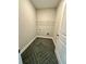 Functional laundry room with a wire shelf and modern flooring at 3740 Cobblestone Dr, Loganville, GA 30052
