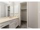 Neutral bathroom with vanity and doorway leading to a closet at 265 N Fayette Ct, Fayetteville, GA 30214