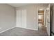 Bedroom featuring neutral walls, carpet floors and a spacious closet at 265 N Fayette Ct, Fayetteville, GA 30214