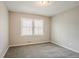 Bedroom with neutral walls, carpet flooring, and natural light at 265 N Fayette Ct, Fayetteville, GA 30214