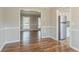 Open dining room featuring beautiful hardwood floors and neutral wall paint at 265 N Fayette Ct, Fayetteville, GA 30214