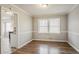 Inviting dining area with natural light, neutral walls, wood floors, and convenient access to the kitchen at 265 N Fayette Ct, Fayetteville, GA 30214