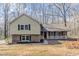 Charming split-level home featuring a brick and siding exterior and a cozy front porch at 265 N Fayette Ct, Fayetteville, GA 30214