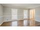 Bright living room featuring hardwood floors, wainscoting, and natural light at 265 N Fayette Ct, Fayetteville, GA 30214