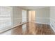 Bright living room featuring hardwood floors, wainscoting, and natural light at 265 N Fayette Ct, Fayetteville, GA 30214