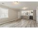 Spacious living area featuring neutral walls, and wood-look floors, offering lots of natural light at 265 N Fayette Ct, Fayetteville, GA 30214