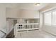 Bright and open living area featuring a white fireplace, neutral walls, and a view of the downstairs at 265 N Fayette Ct, Fayetteville, GA 30214