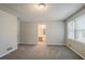 Spacious main bedroom features a large window and neutral walls at 265 N Fayette Ct, Fayetteville, GA 30214