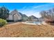 Serene backyard with a kidney-shaped pool and grassy area at 521 James Ridge Ln, Stockbridge, GA 30281