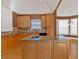 Kitchen with granite countertops and light wood cabinets at 521 James Ridge Ln, Stockbridge, GA 30281