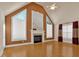 Spacious living room featuring hardwood floors, a fireplace, and large windows at 521 James Ridge Ln, Stockbridge, GA 30281