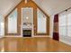 Spacious living room featuring hardwood floors, a fireplace, and large windows at 521 James Ridge Ln, Stockbridge, GA 30281