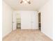 Bright bedroom featuring neutral carpet, ceiling fan, and an adjoining closet at 5672 Kingsport Dr # 4, Atlanta, GA 30342