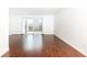 Living room boasts hardwood floors and sliding glass door to the outdoor patio at 5672 Kingsport Dr # 4, Atlanta, GA 30342