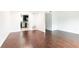 Living room with hardwood floors leading into the kitchen and other rooms at 5672 Kingsport Dr # 4, Atlanta, GA 30342