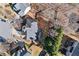 A bird's eye view of a home with lush landscaping, a private backyard, and a well-maintained roof at 1302 Turtlebrook Ln, Lawrenceville, GA 30043