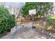 Enjoyable backyard with a basketball hoop and a quaint brick-paved area, perfect for outdoor activities at 1302 Turtlebrook Ln, Lawrenceville, GA 30043